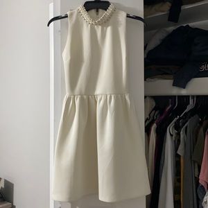 Sleeveless formal white dress with beaded collar